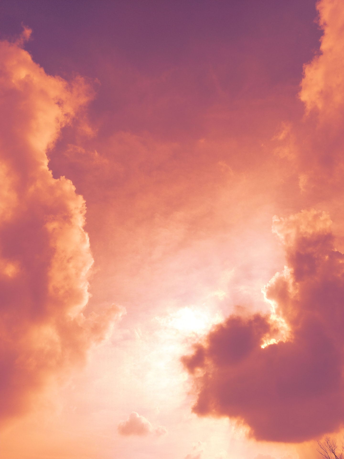 Warm evening light breaking through clouds, a quiet threshold in the sky